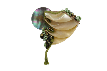 brooch: fabrics, nautilus shell, mother of pearl, glass beads