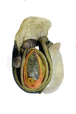 brooch: fabrics, serpentine, snail's shells